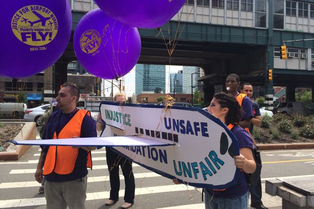 Airline workers protesting outside of JetBlue headquarters in June
